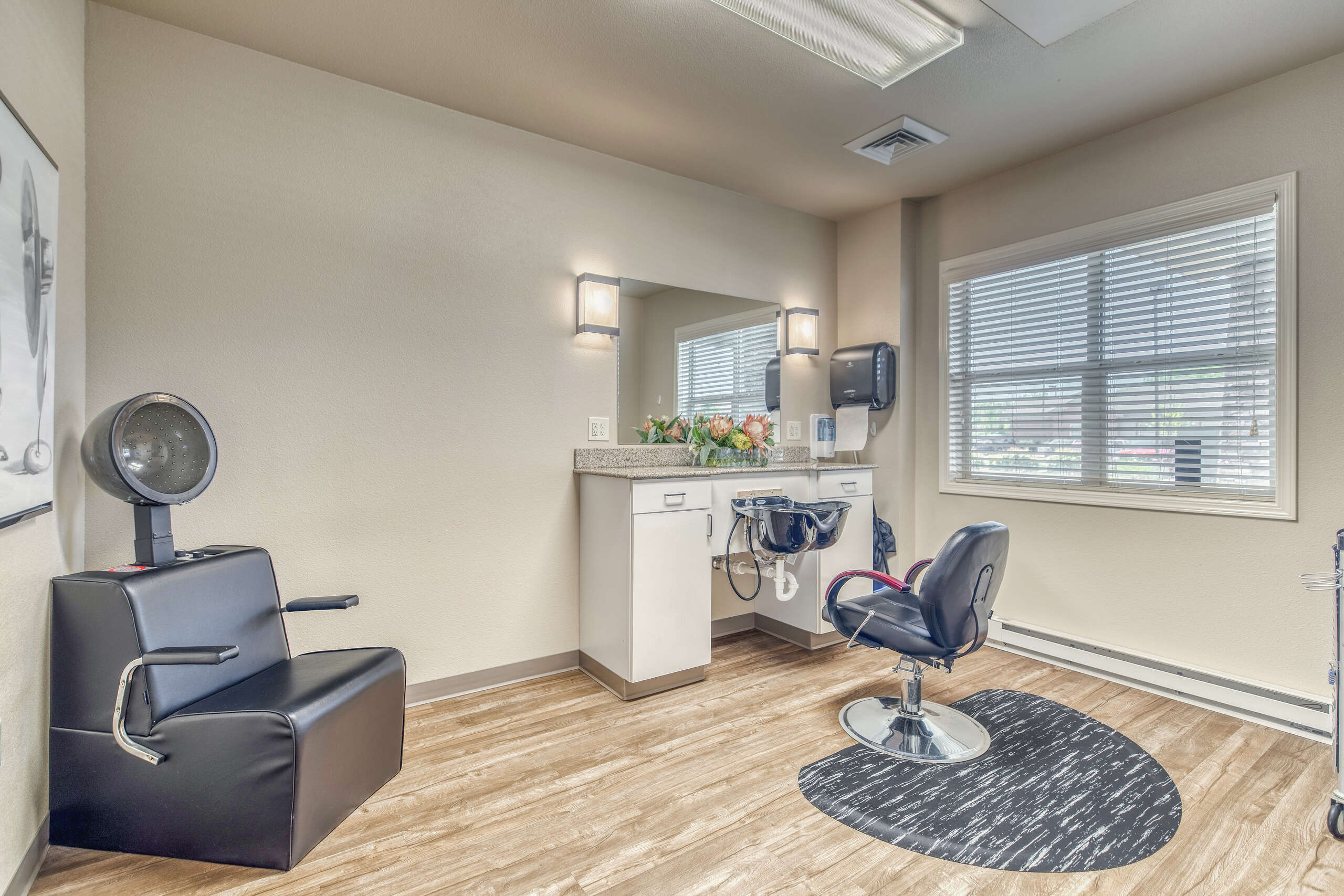 Salon area with styling chair and mirror