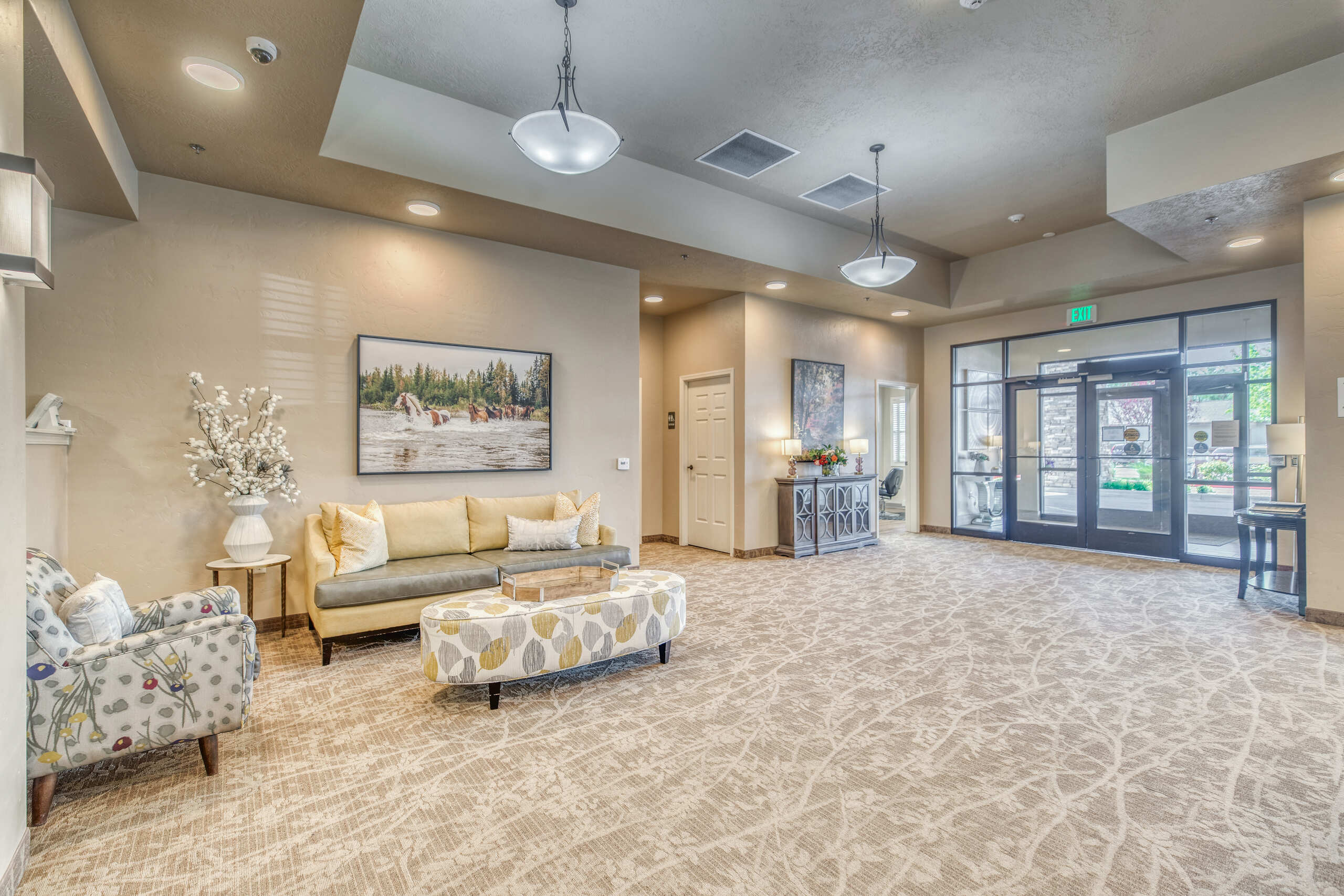 Bright and inviting common area with seating and artwork