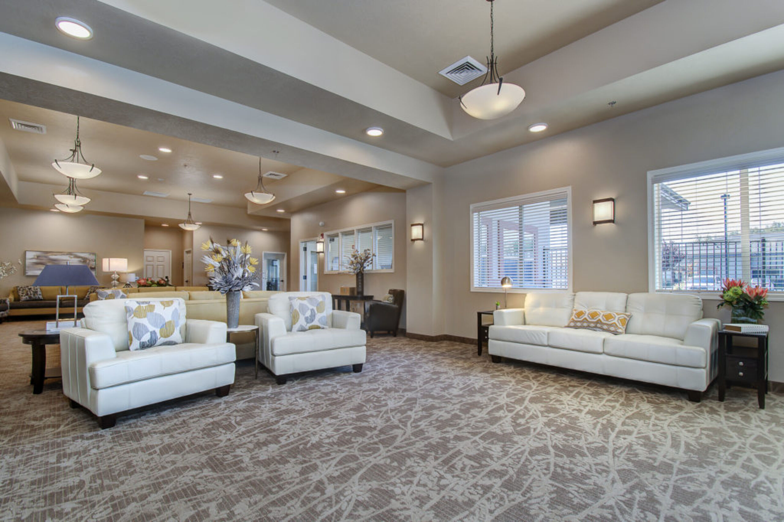 Interior lounge area with white sofas and decor