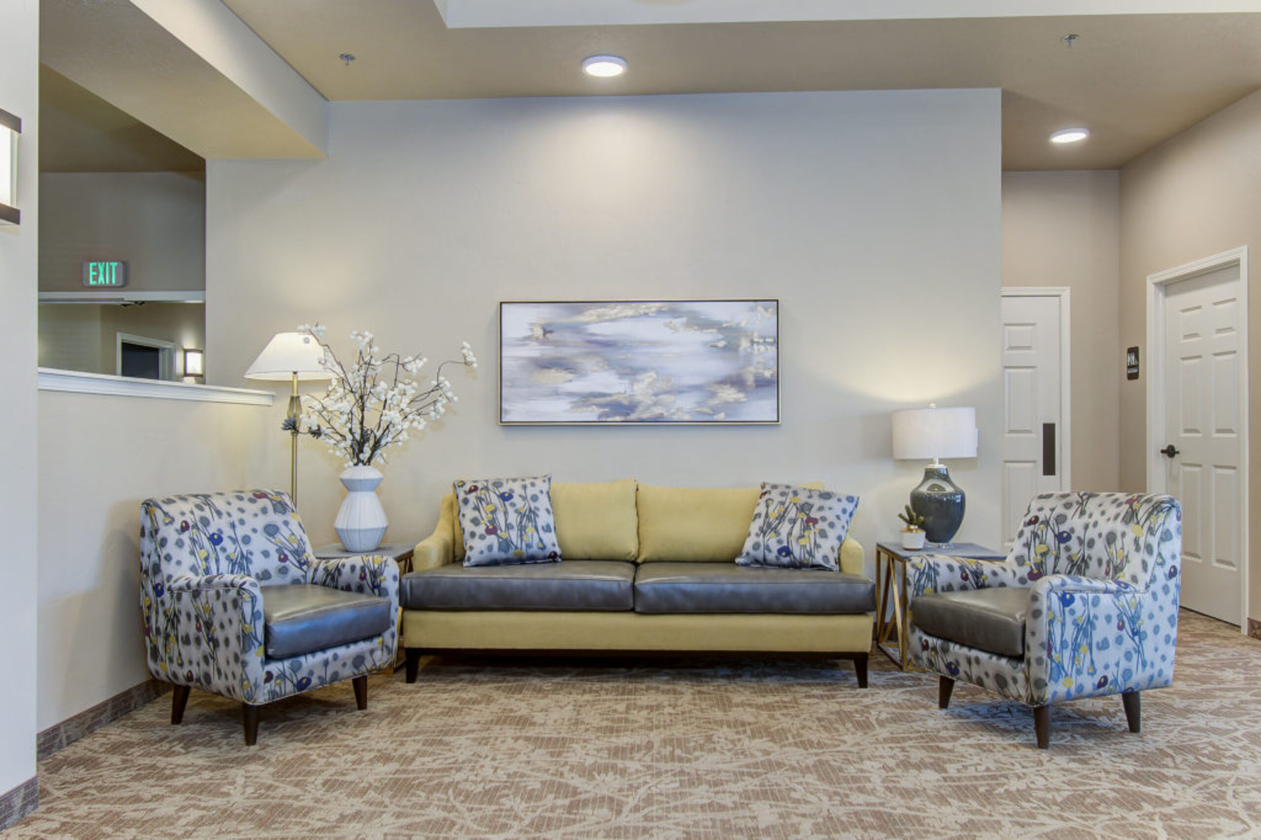 Cozy lobby seating area with floral decor