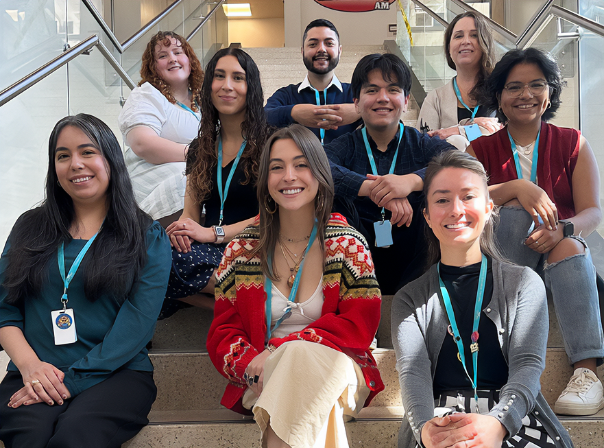 Group of staff members posing together indoors