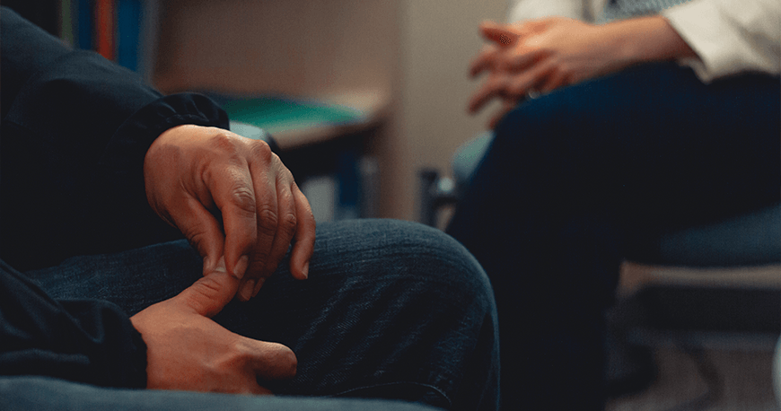 Close-up of hands during a conversation.