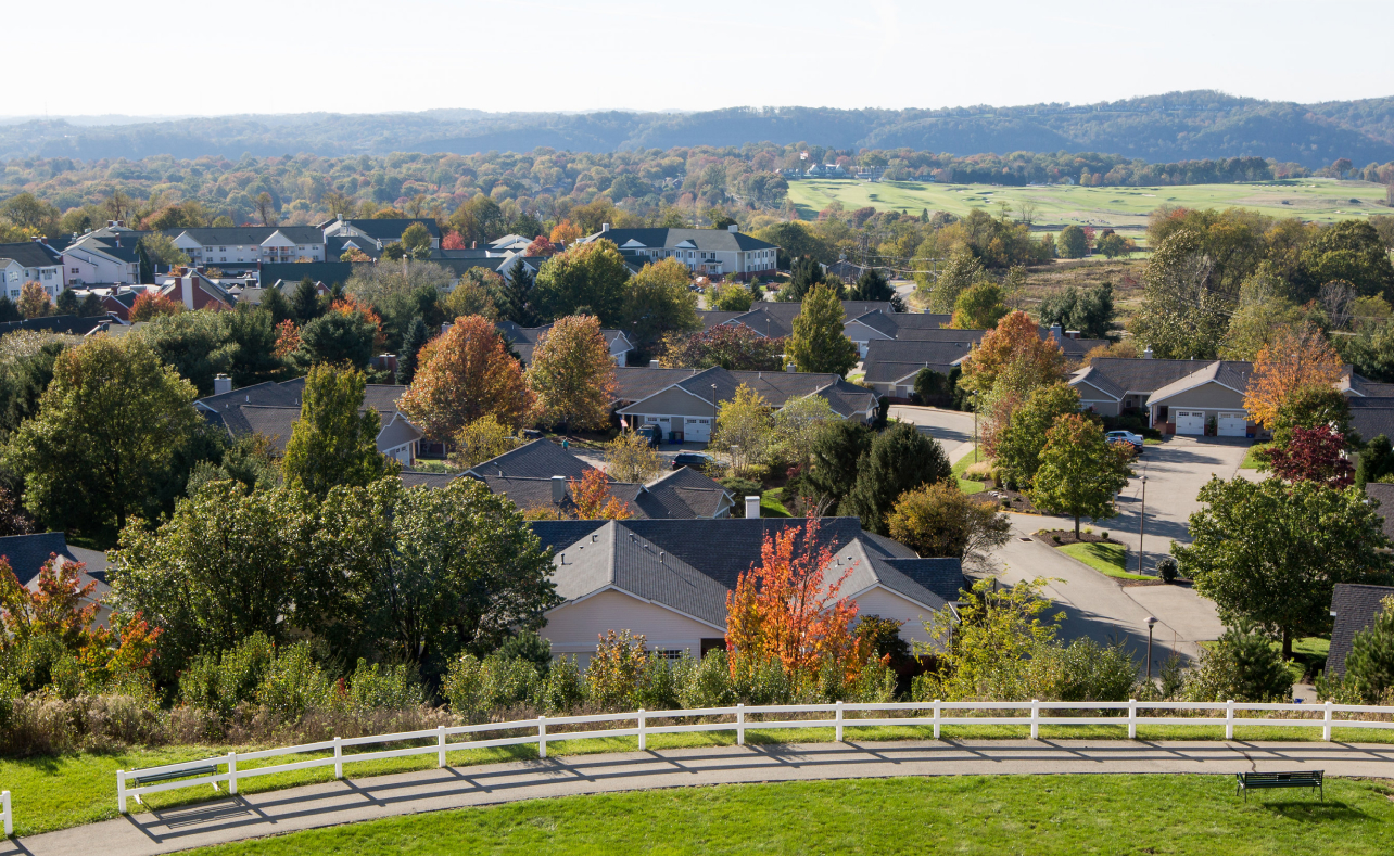 Scenic view of residential community with autumn foliage.