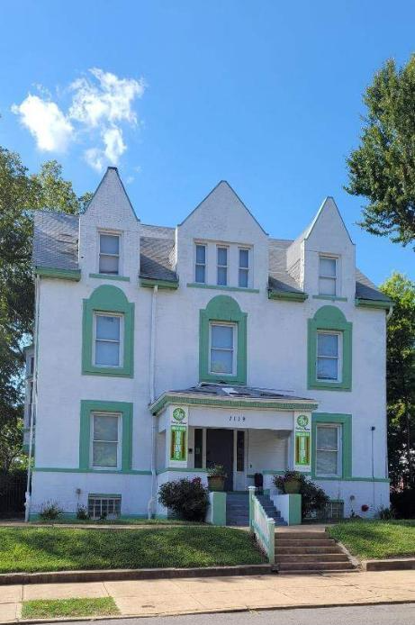 Exterior view of Smiley Manor with green accents
