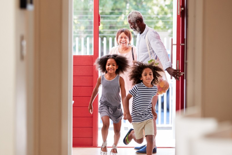 Happy family entering the facility