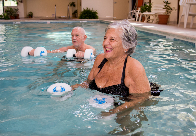 Residents exercising in a swimming pool