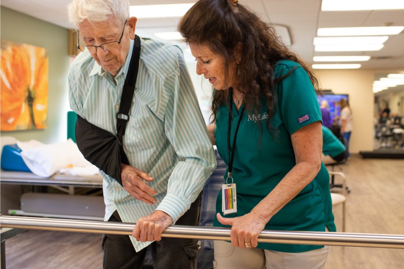 Staff assisting a resident with mobility