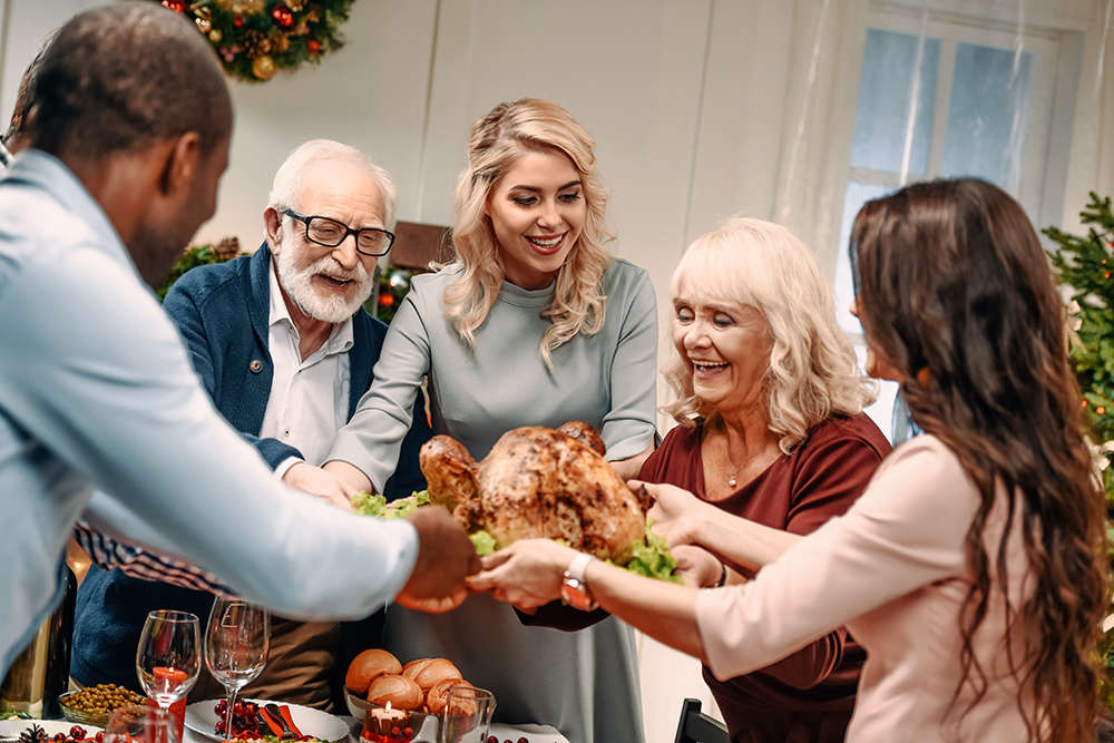 Residents and staff celebrating a holiday meal together