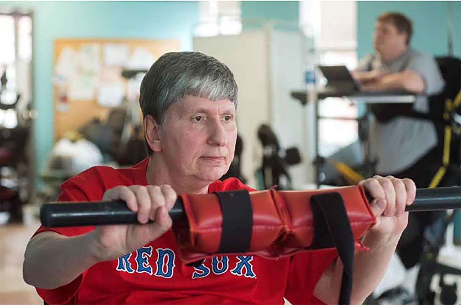 Resident engaging in exercise at a gym.