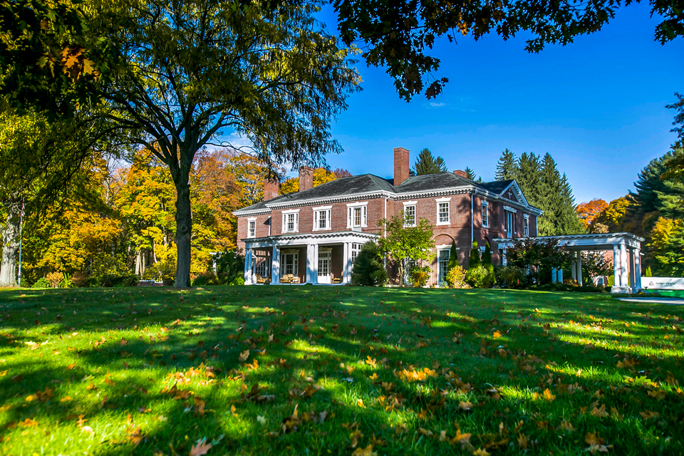 Exterior view of a nursing facility surrounded by trees