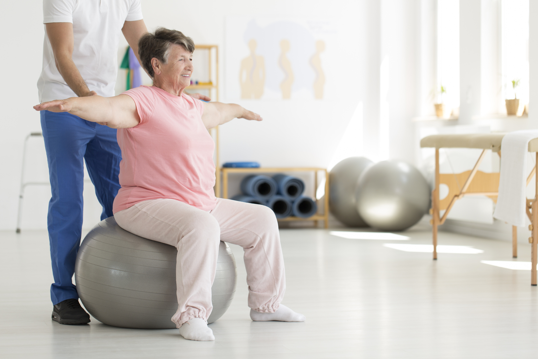 Senior woman exercising on a stability ball.