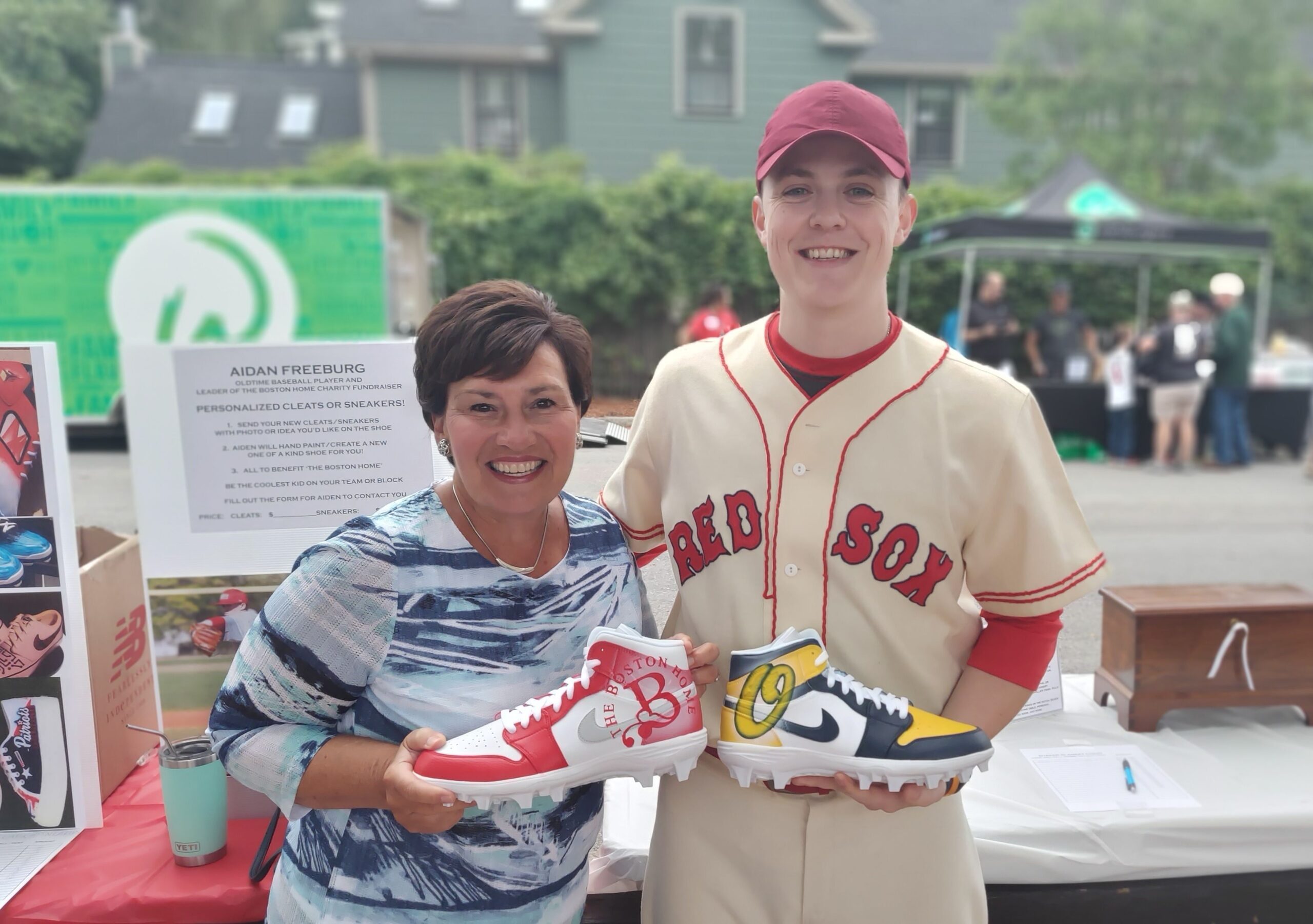 A participant holding shoes at an event.