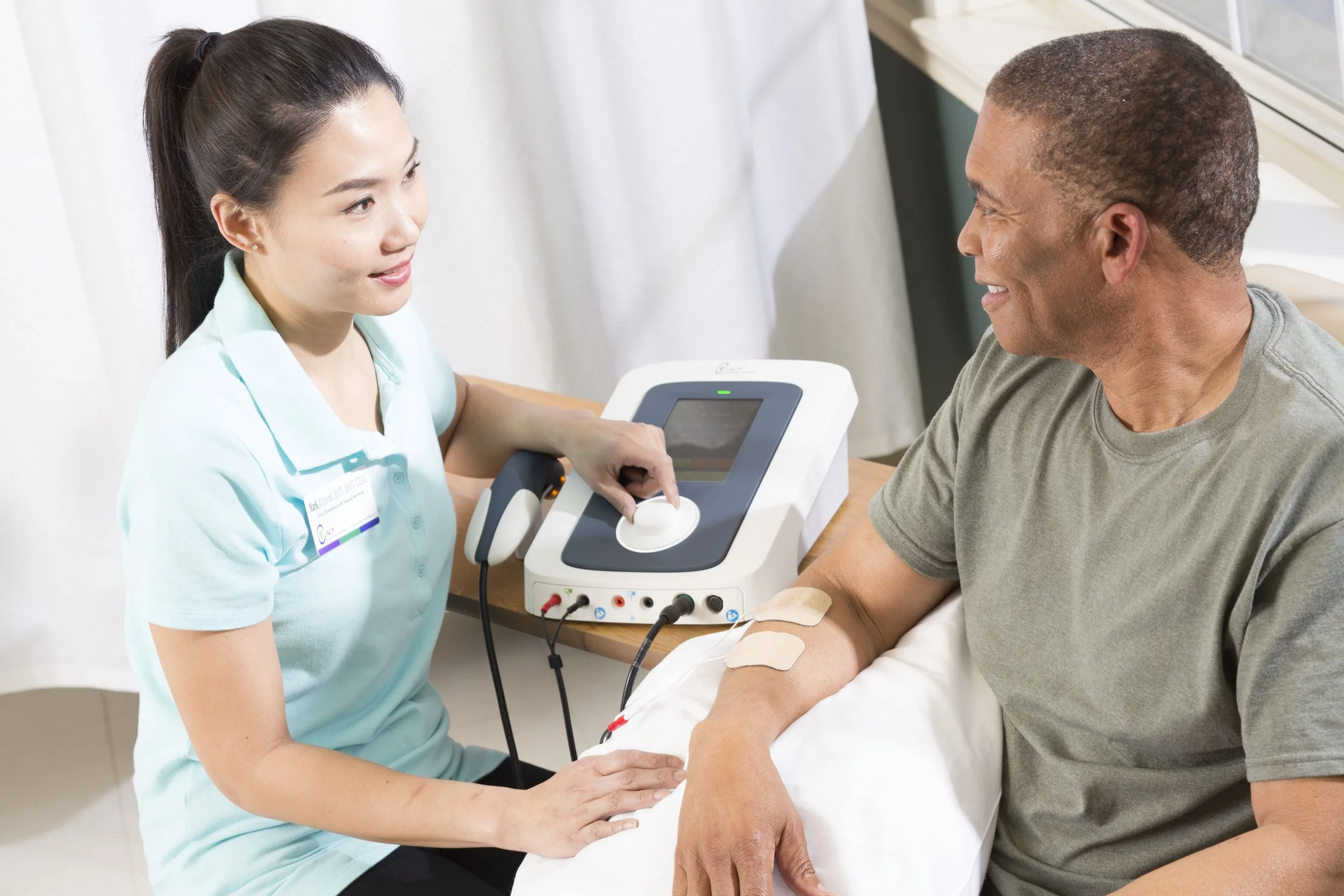 Healthcare worker assisting resident with therapy