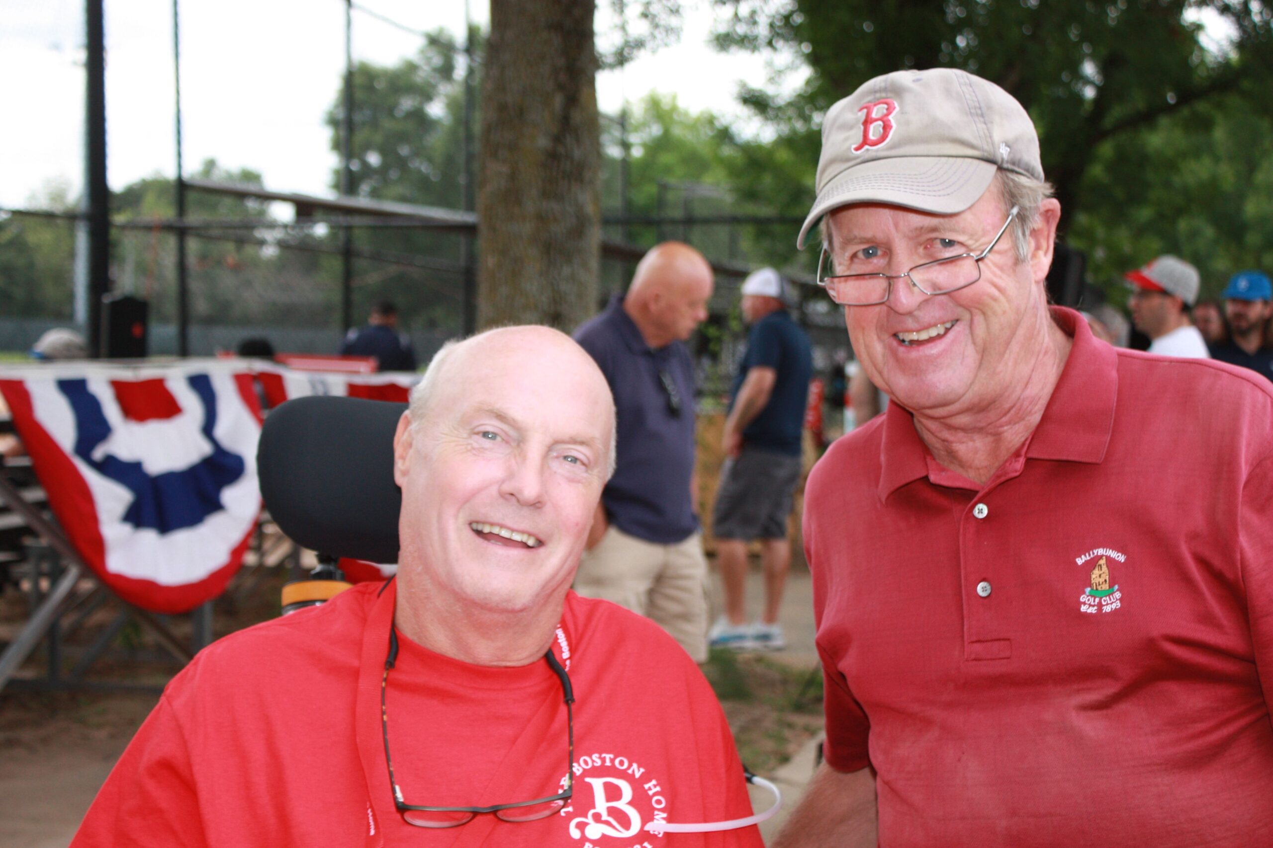 Two residents enjoying time outdoors at a baseball event.