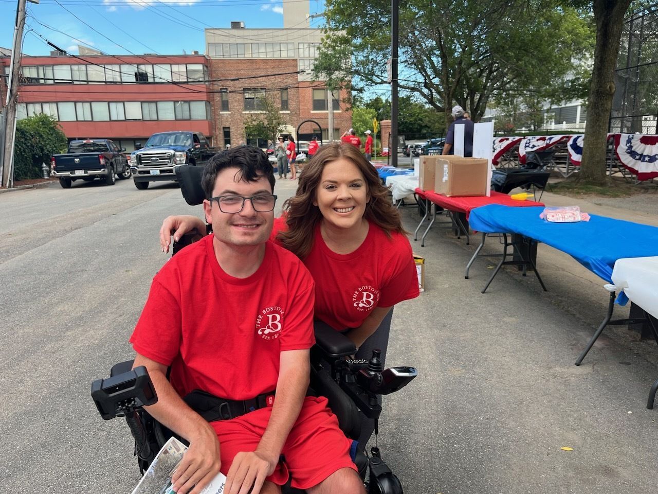 Two residents smiling at an outdoor event.