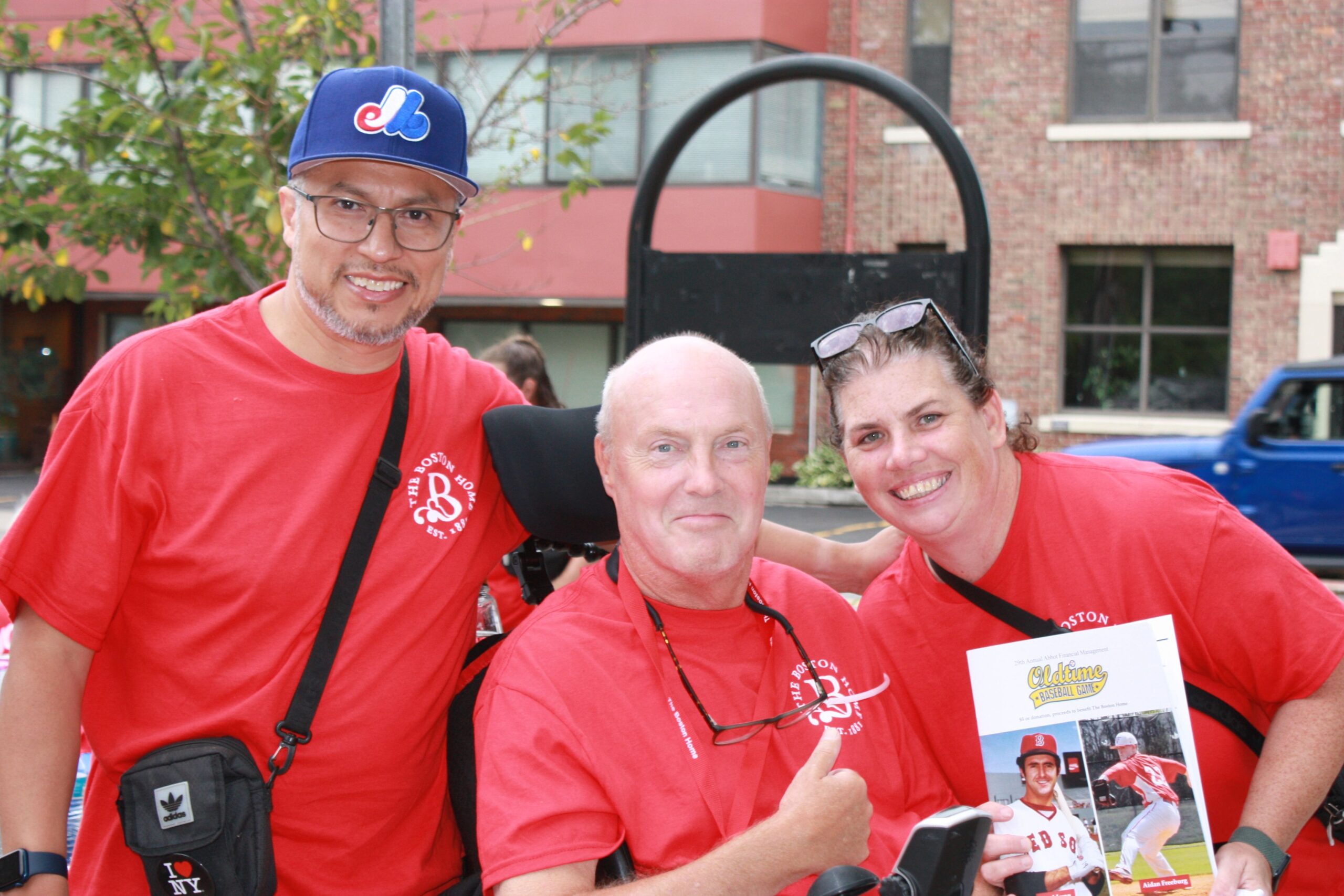 Residents and staff enjoying an outdoor event together.