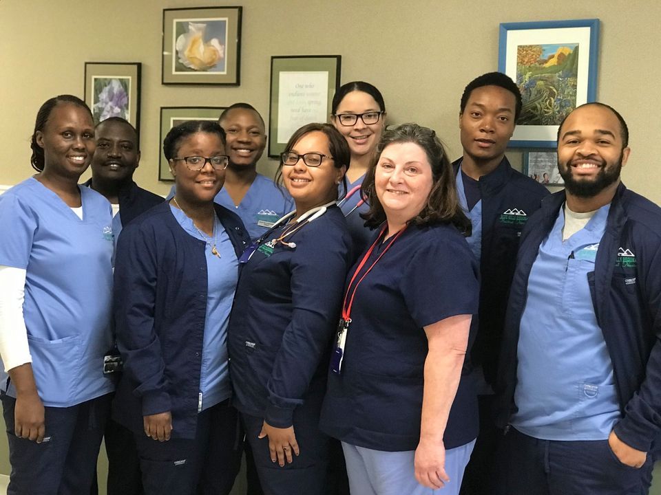 Nursing staff posing together in a common area