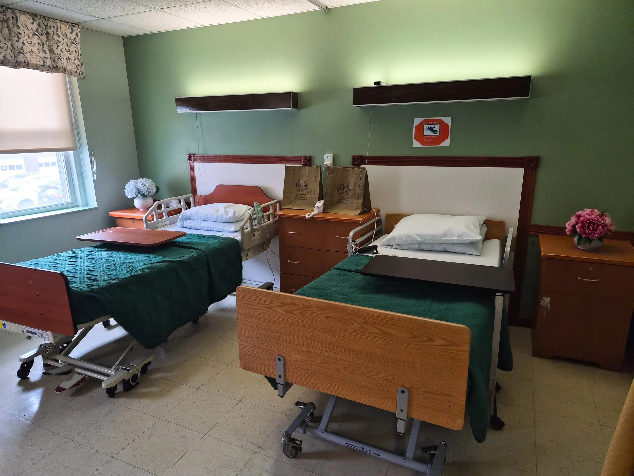 A view of two resident beds in a shared room.