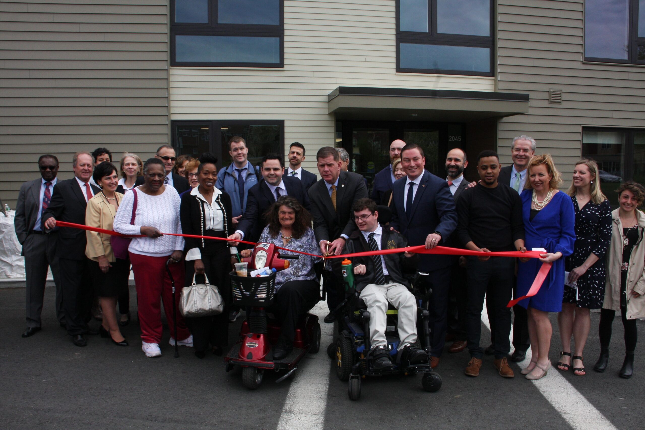 Ribbon-cutting ceremony with residents and staff