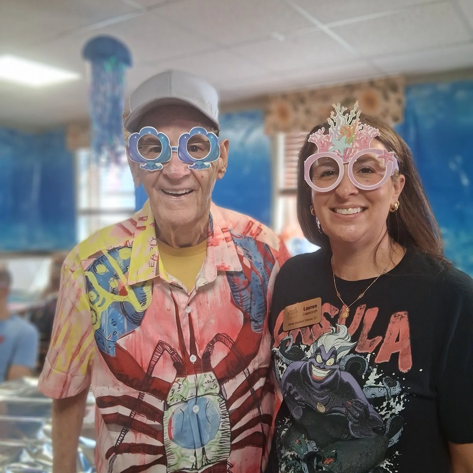 Resident and staff member enjoying a themed activity together.