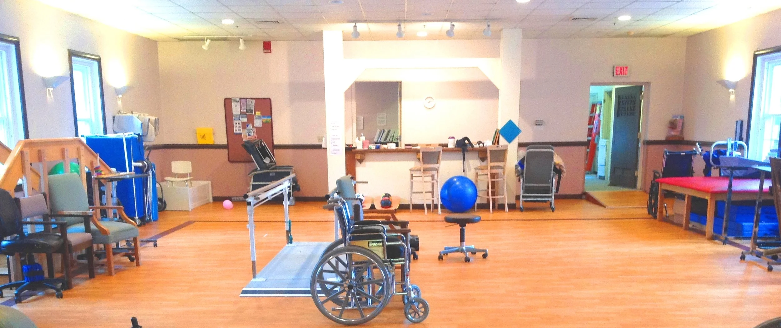 Physical therapy room with exercise equipment