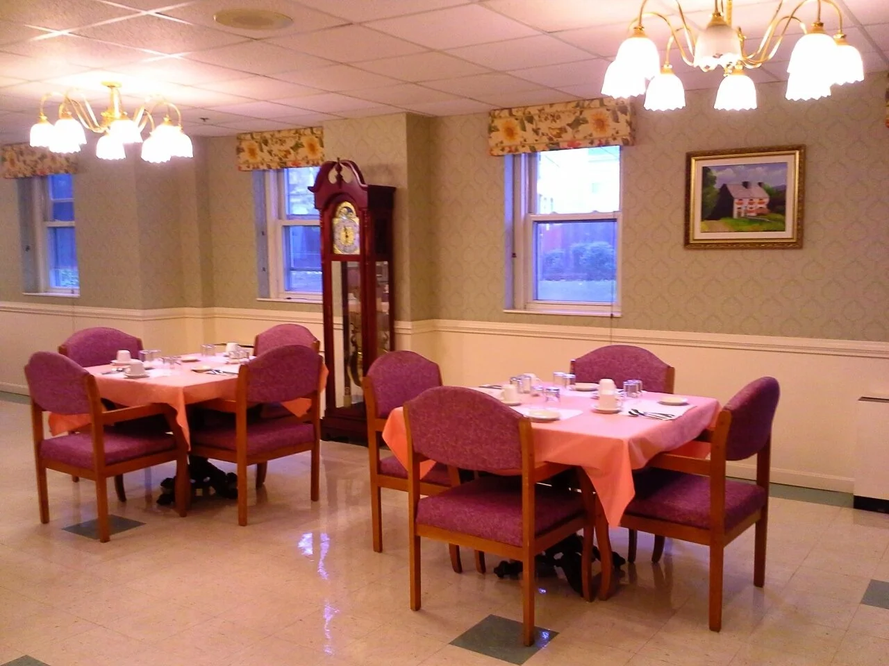 Dining area with tables set for a meal.