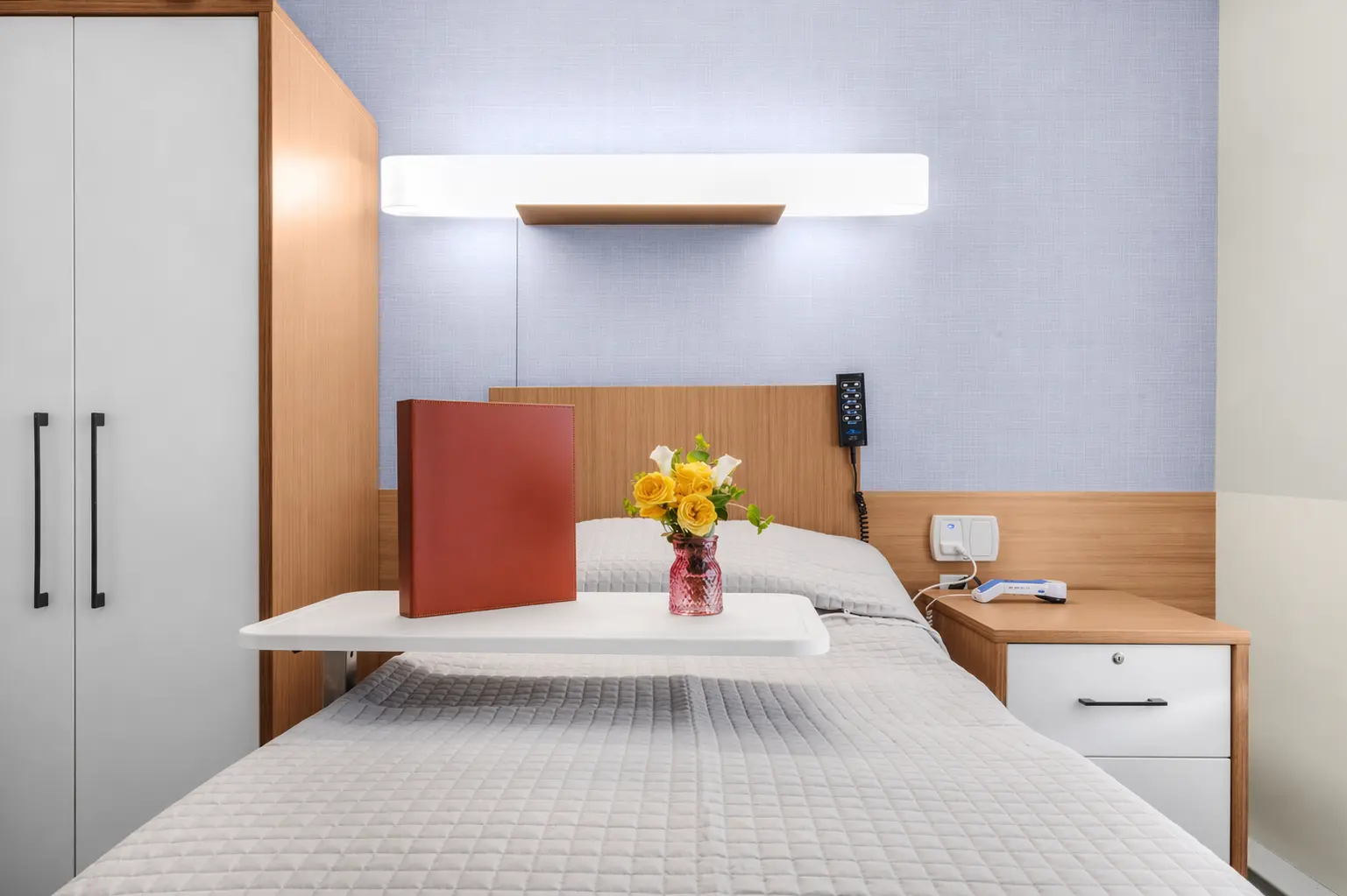 Cozy resident room with flowers and a tray