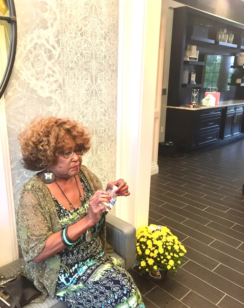 Resident enjoying a moment in the facility's interior.