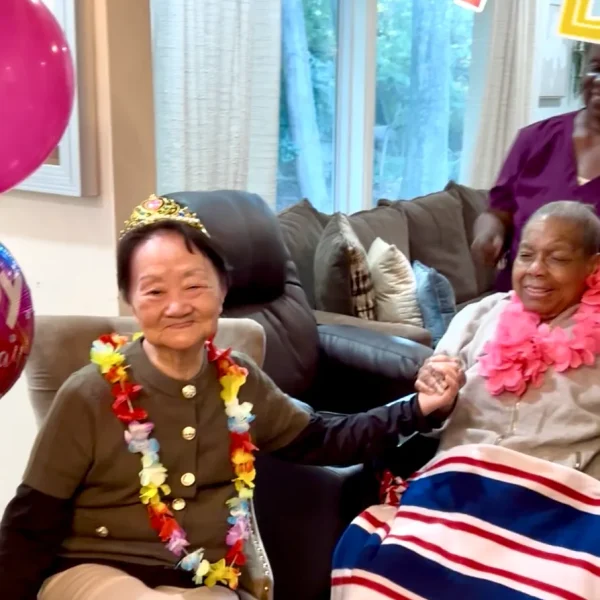 Residents celebrating with decorations and leis