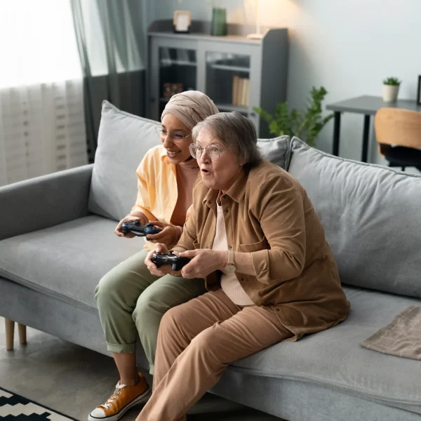 Residents enjoying a gaming session in a common area.