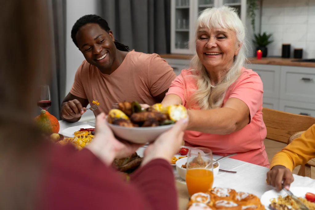 Residents enjoying a meal together at a table.