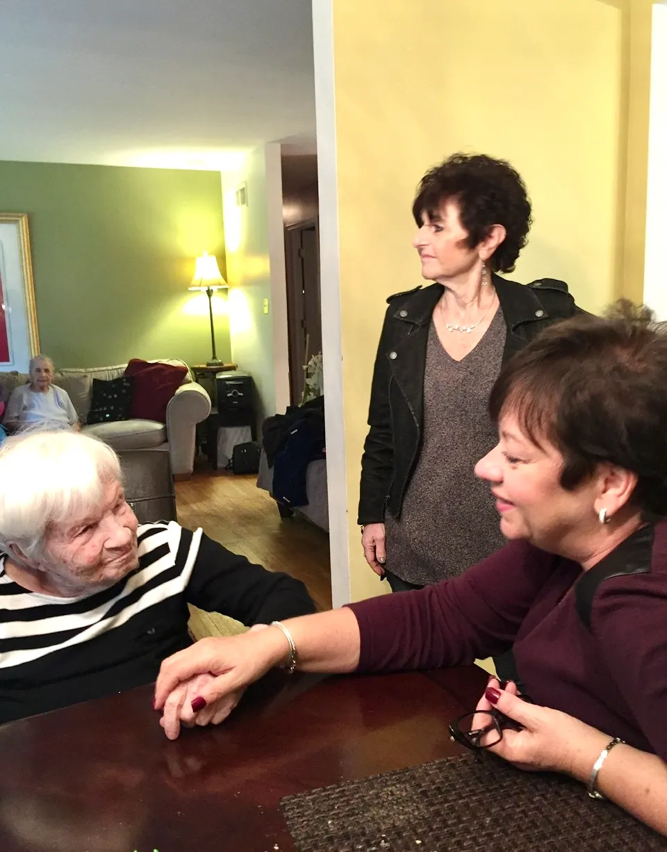 Residents interacting in a common area setting.