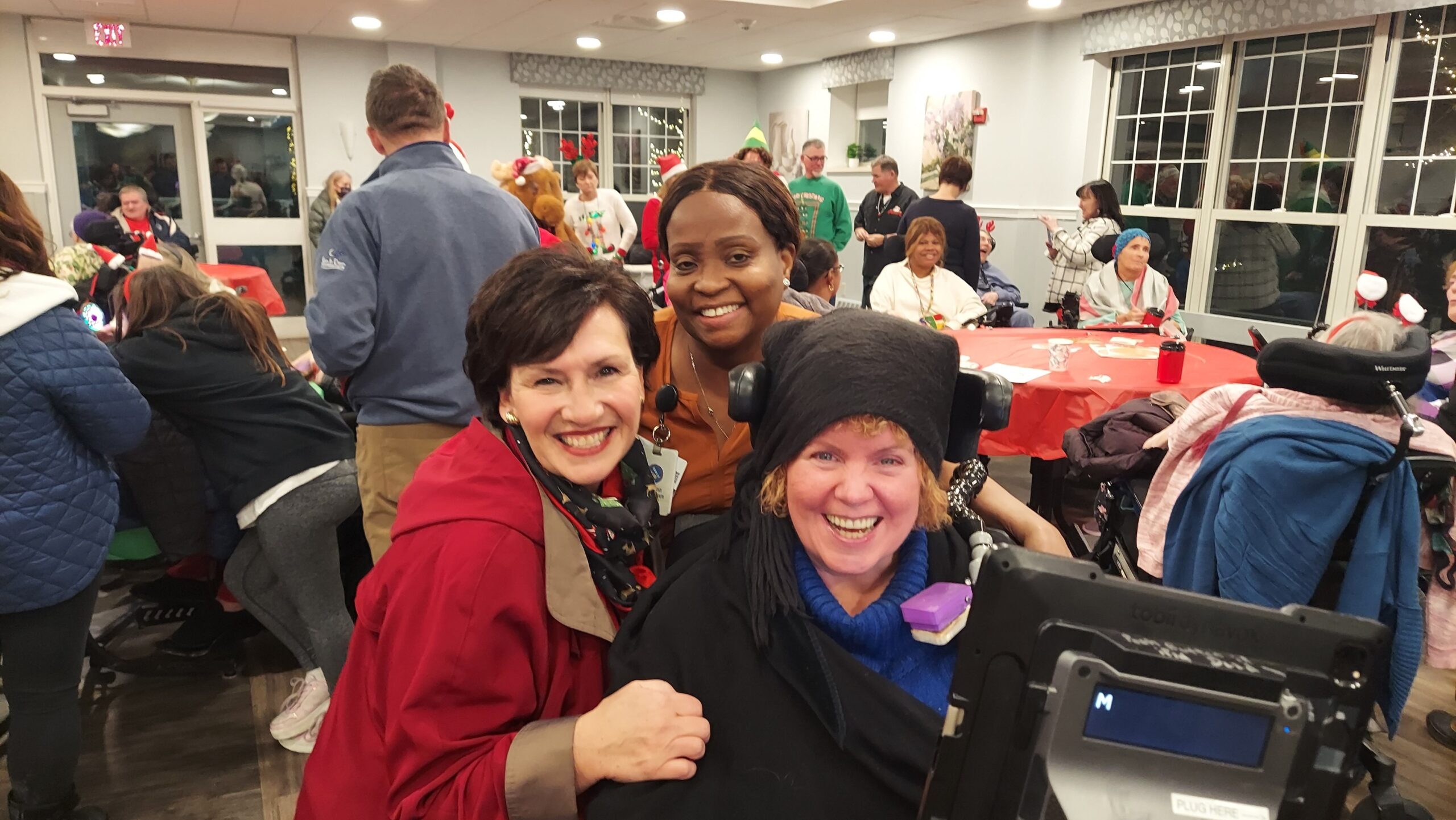 Residents and staff enjoying a festive event together.