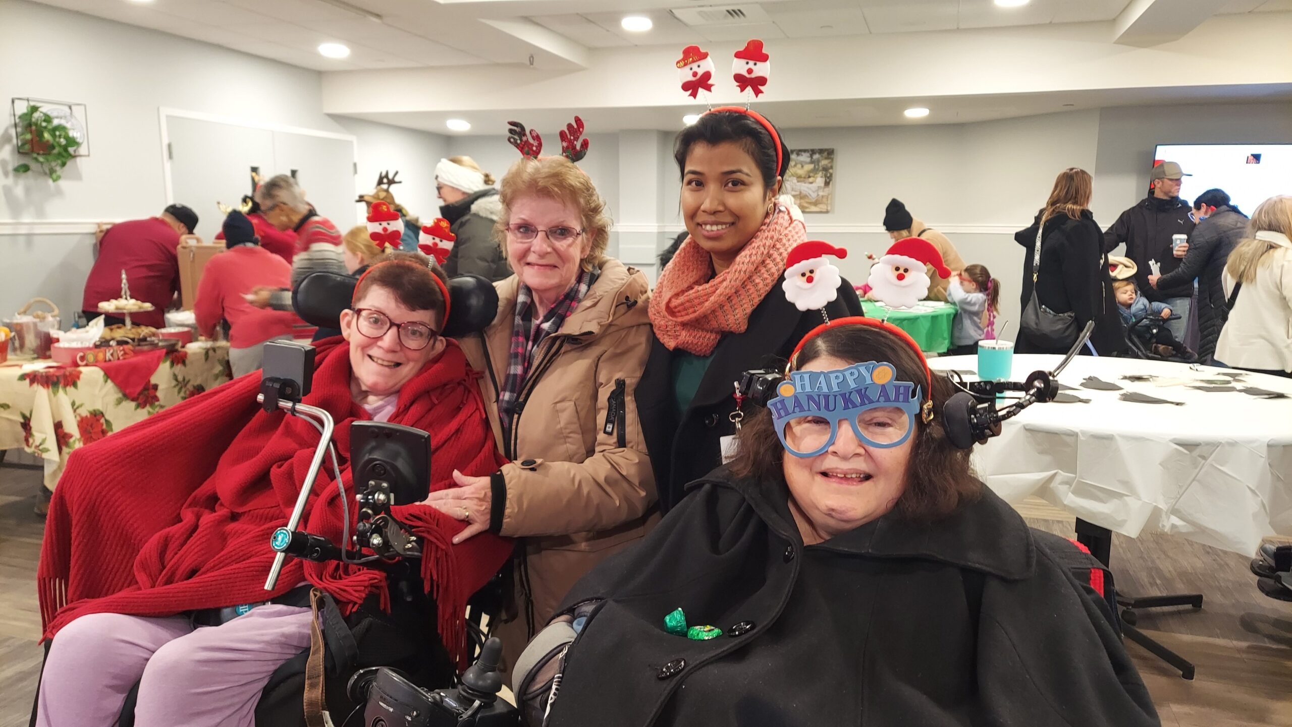 Residents and staff celebrating a festive event together.