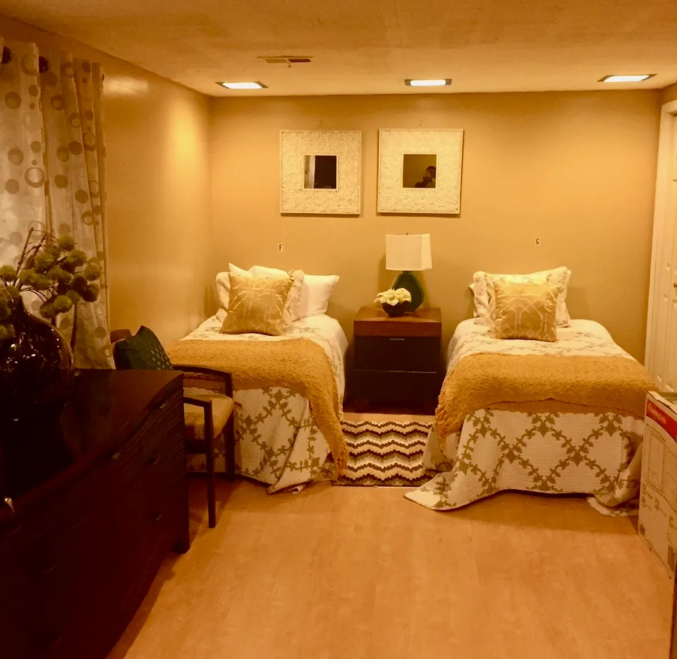 Shared bedroom with twin beds and decor