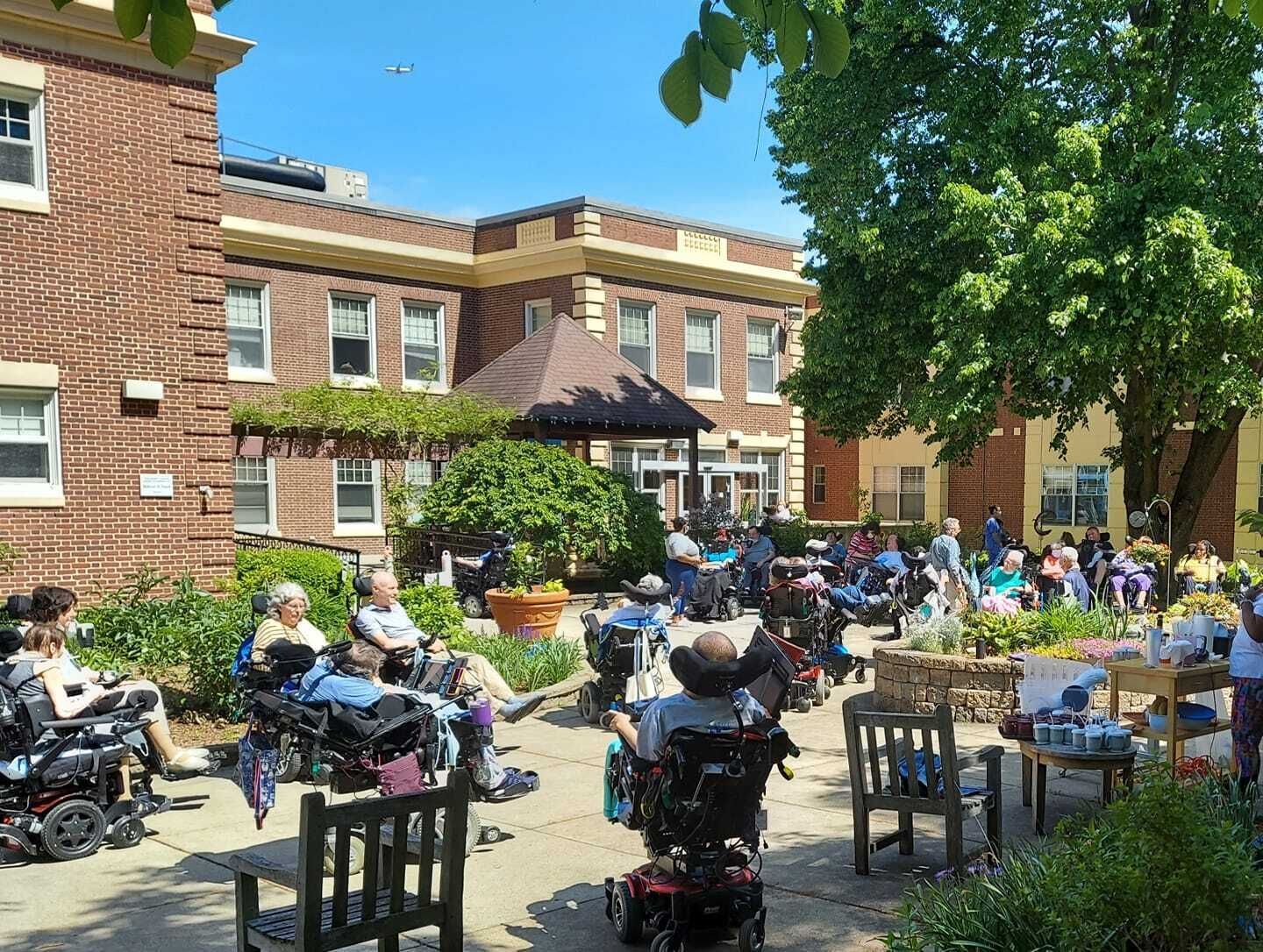 Residents enjoying an outdoor gathering in the courtyard.