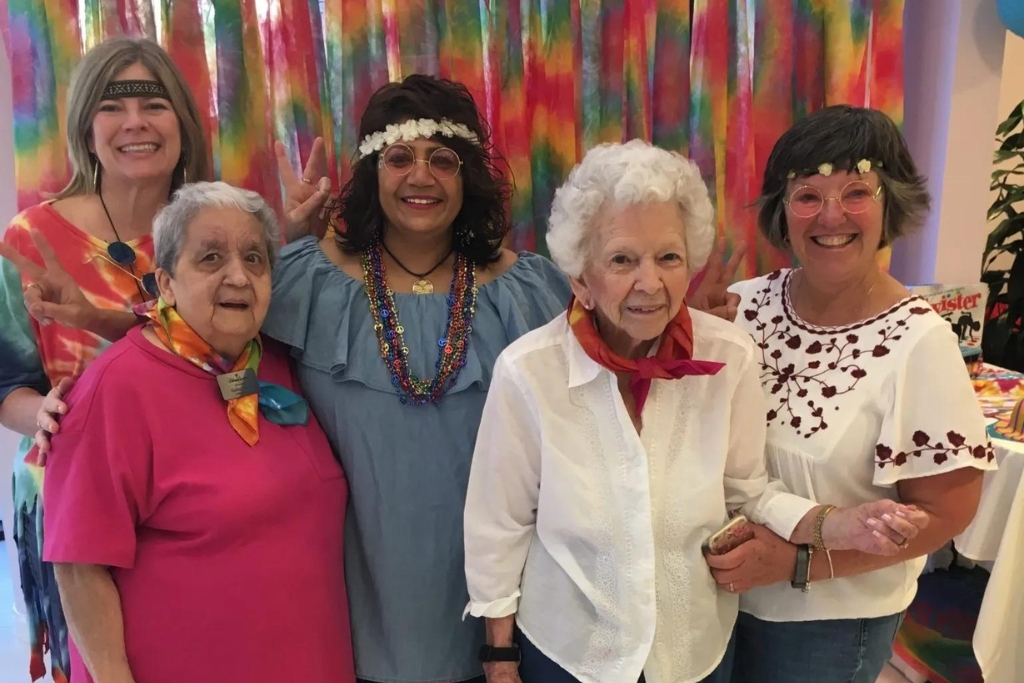 Residents and staff celebrating with colorful attire