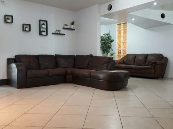 Cozy common area with leather sofas and decor