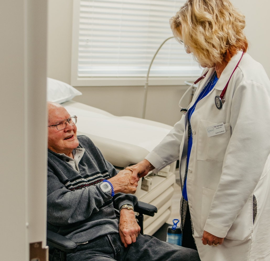 Healthcare professional interacting with a senior resident.