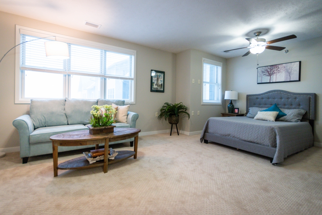 Cozy bedroom and sitting area in assisted living facility