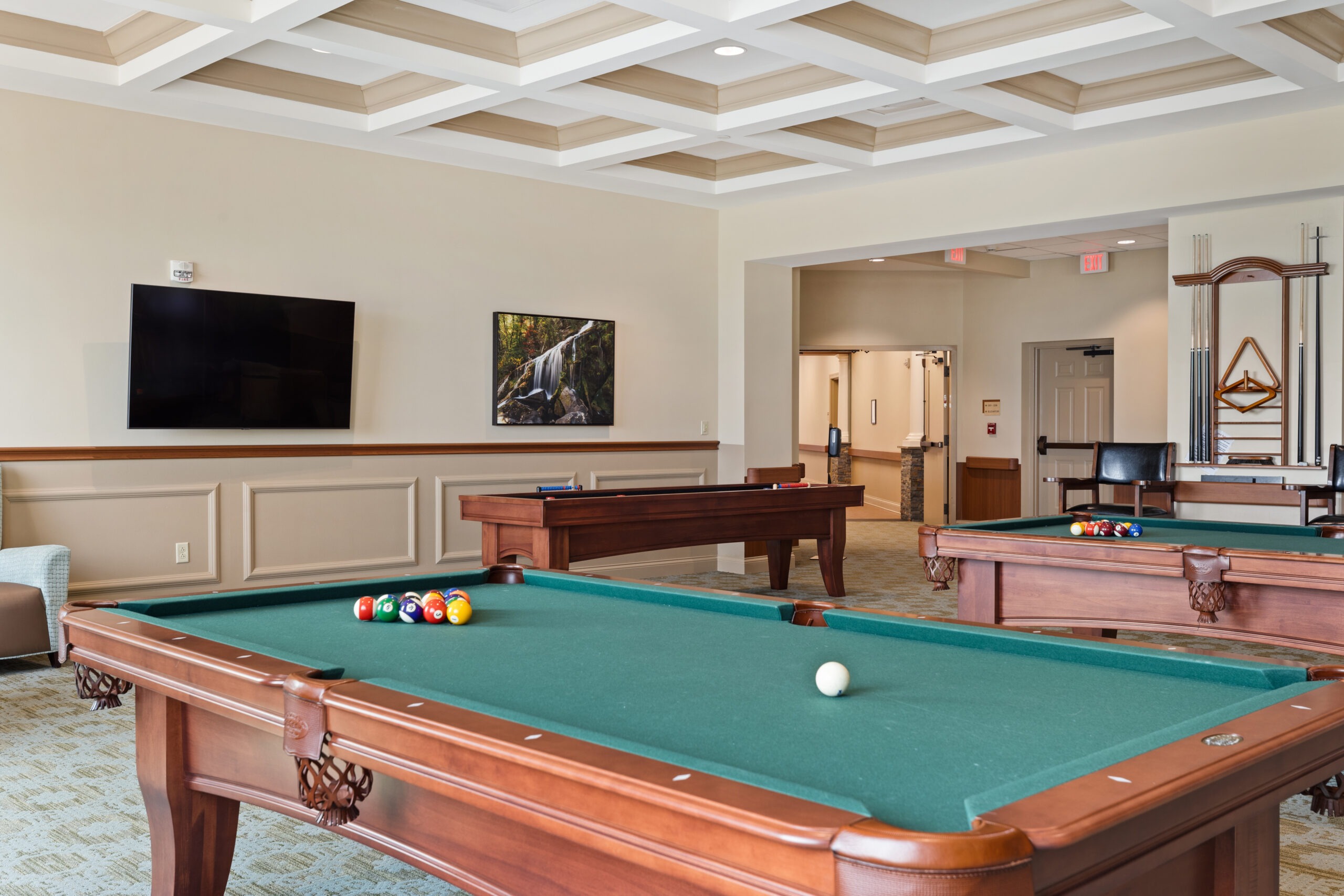 Interior view of a billiards room with pool tables