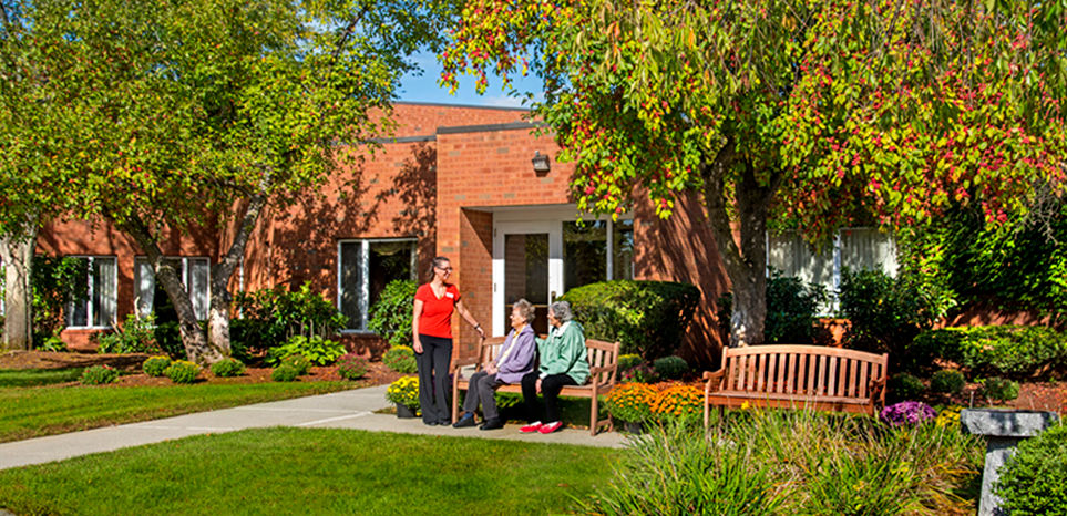 Staff and residents enjoying the outdoor seating area.