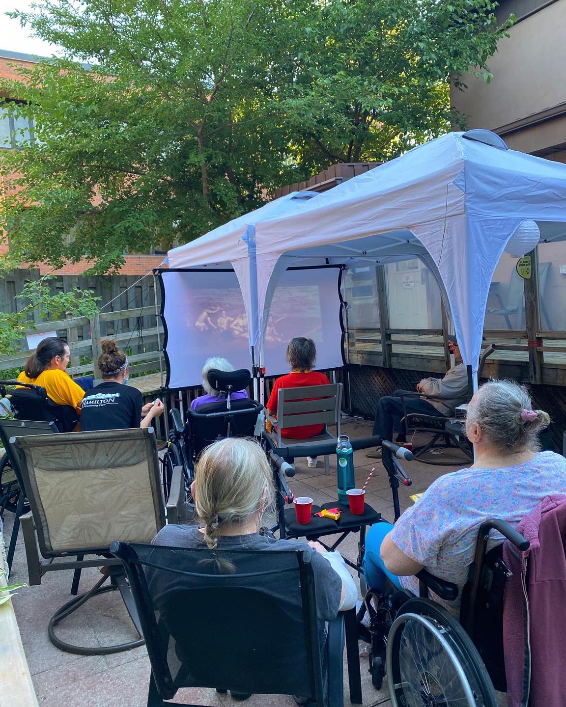 Residents enjoying an outdoor movie screening