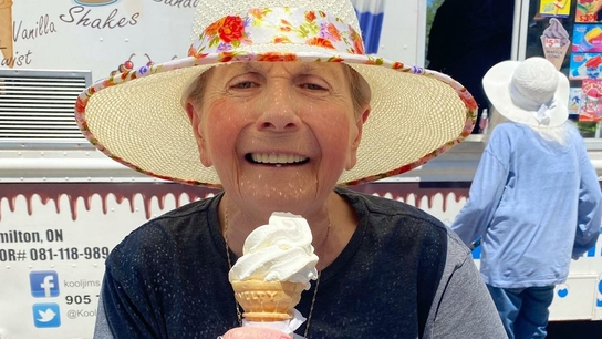 Senior woman enjoying ice cream outdoors