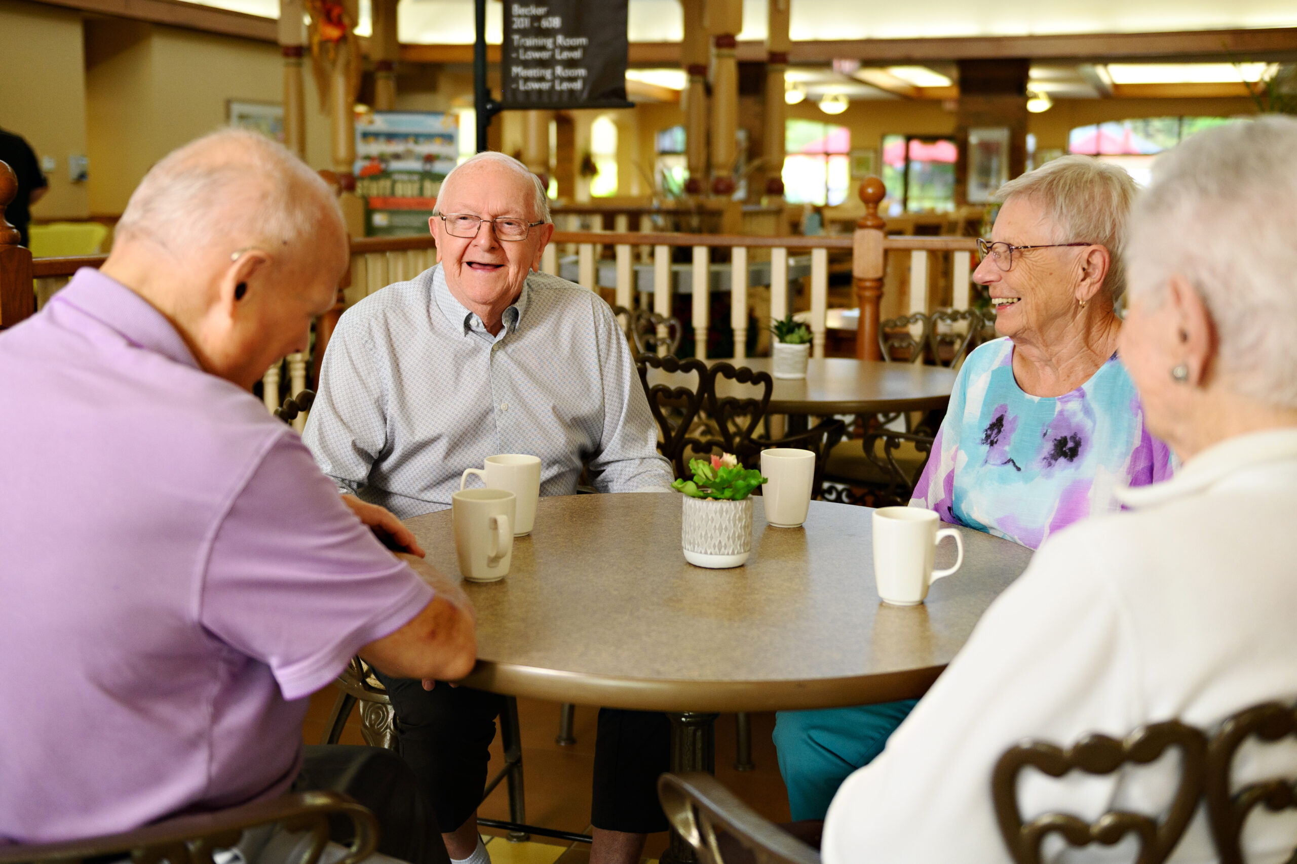 Group of residents enjoying coffee in common area