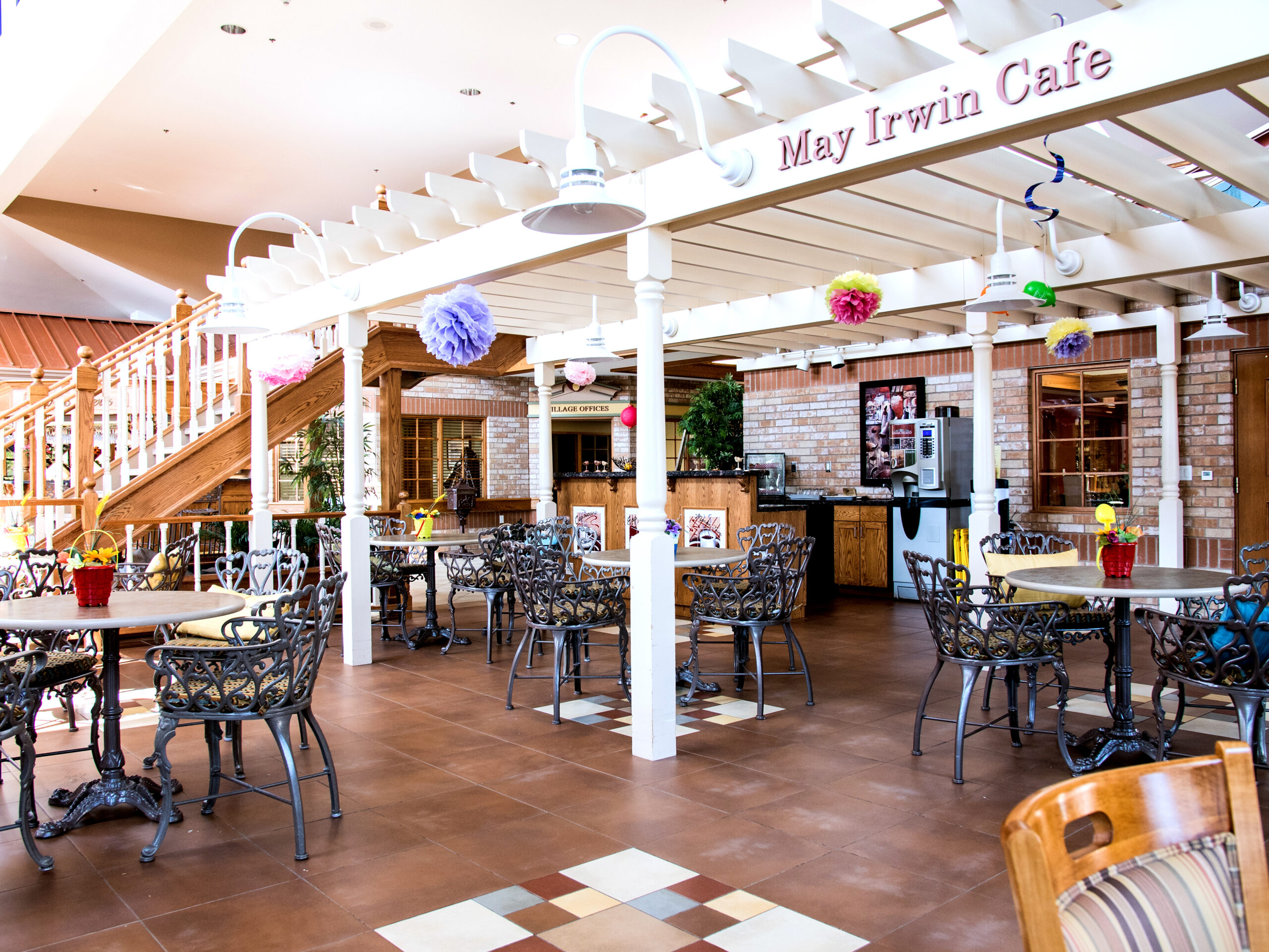 Bright indoor dining area with tables and decor