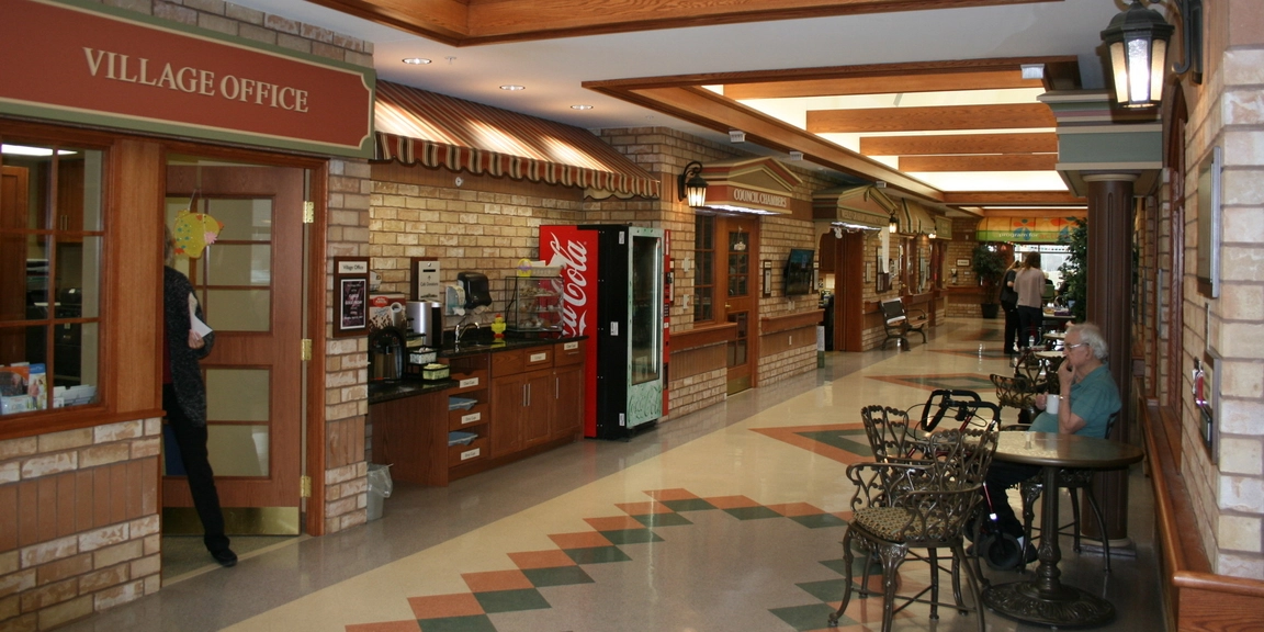 Interior hallway with residents and amenities