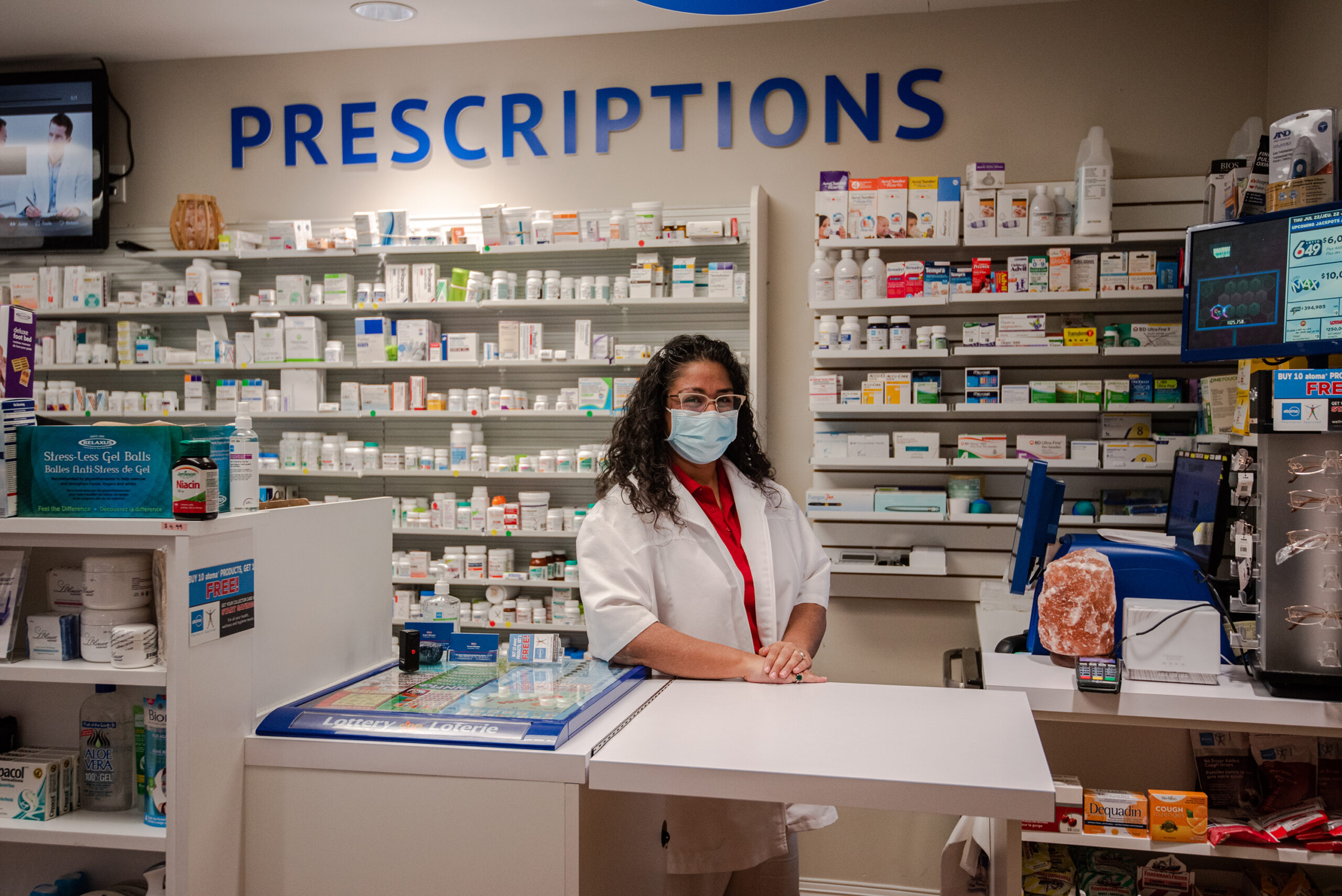 Pharmacy area with staff member in masks