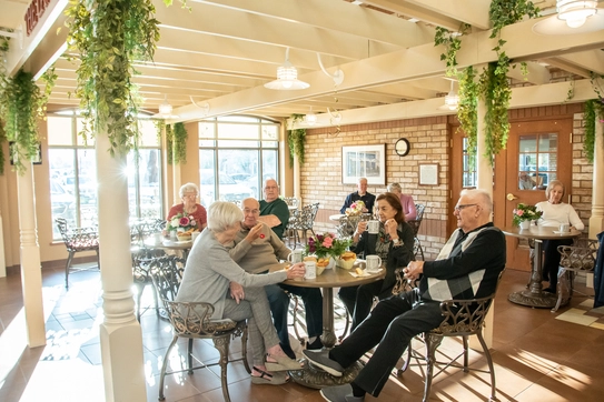 Residents enjoying time in a well-lit common area