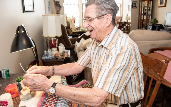 Senior resident engaged in a crafting activity